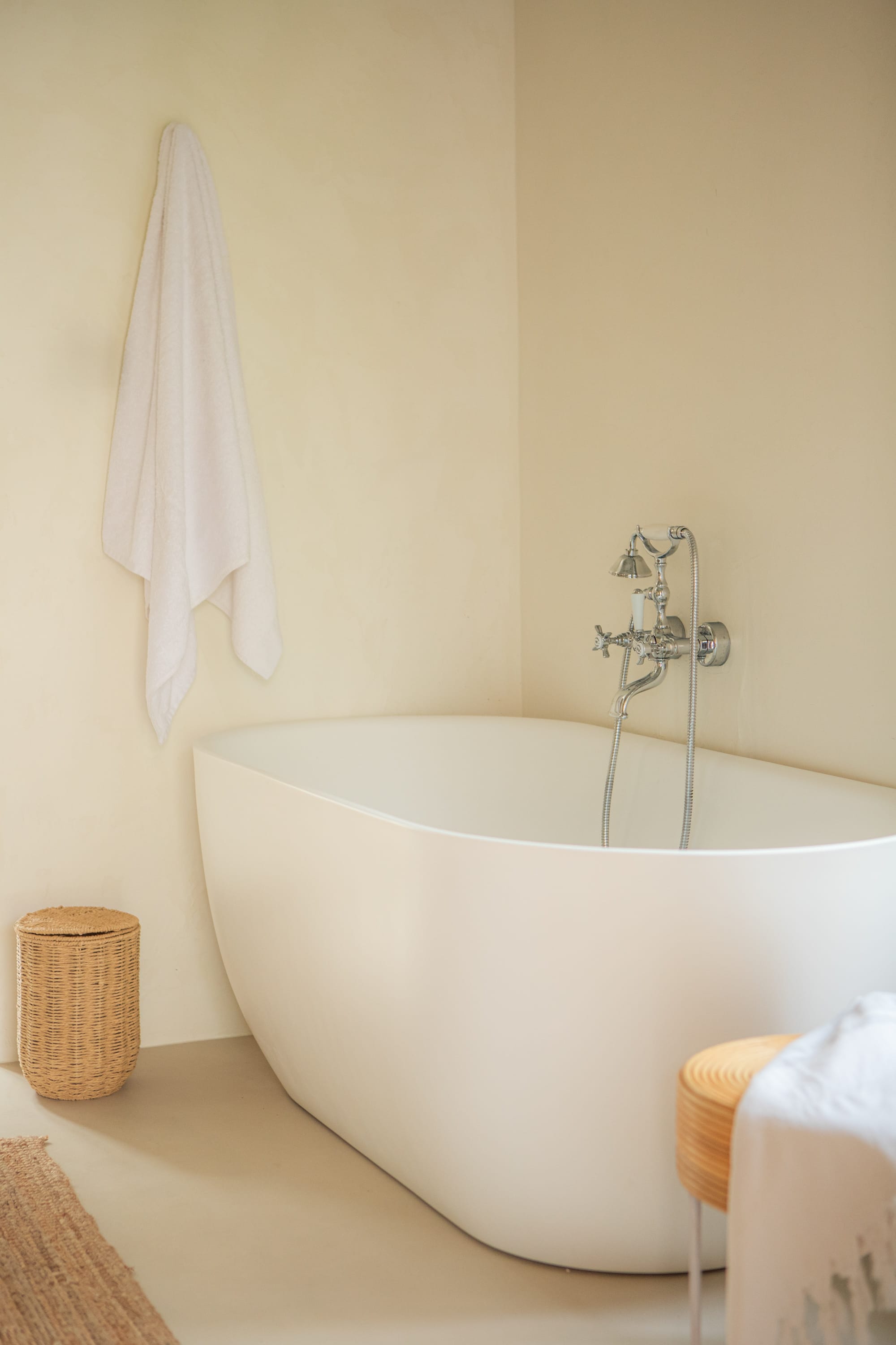 a bathtub with a towel on the wall