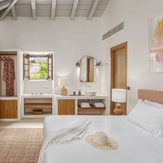 a bedroom with a bed and a mirror