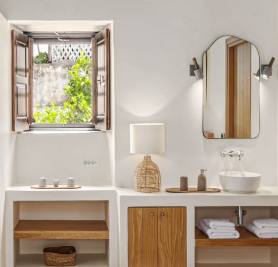 a bathroom with a mirror and sink