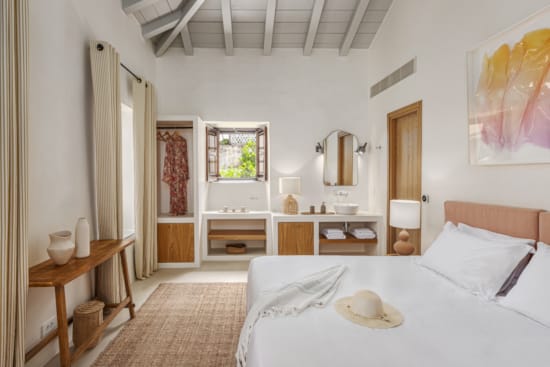 a bedroom with a bed and a table