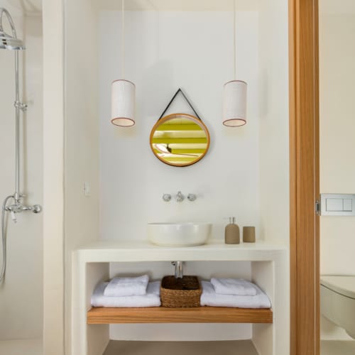 a bathroom with a mirror and sink