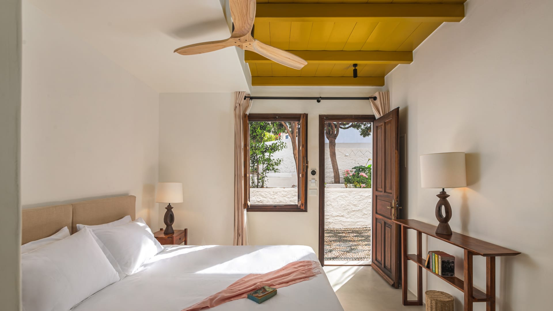 a bedroom with a fan