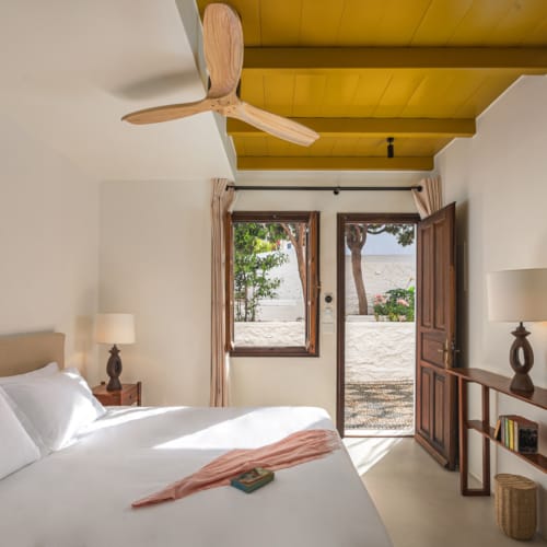 a bedroom with a fan