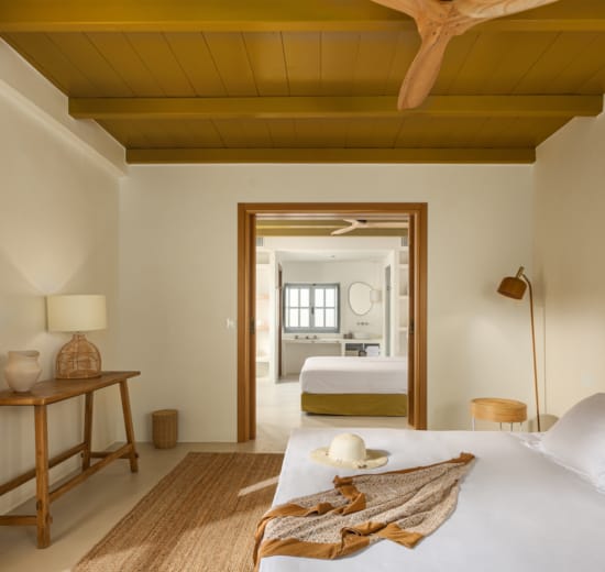 a bedroom with a large mirror