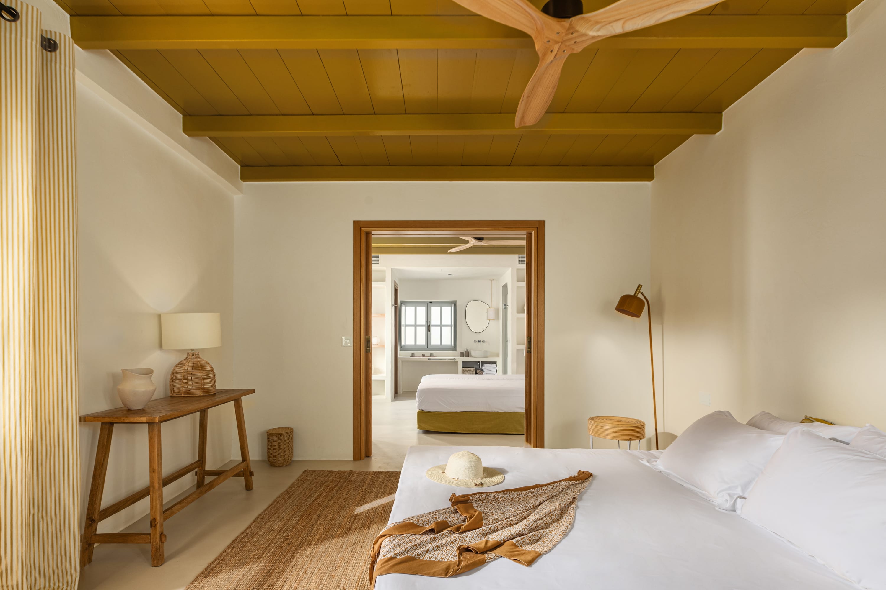 a bedroom with a bed and a table