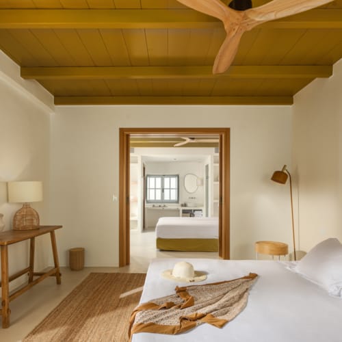 a bedroom with a bed and a table