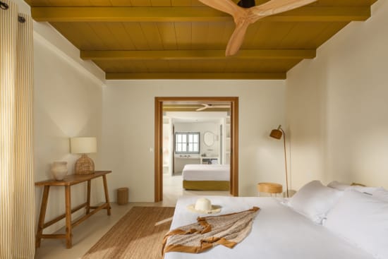 a bedroom with a bed and a table