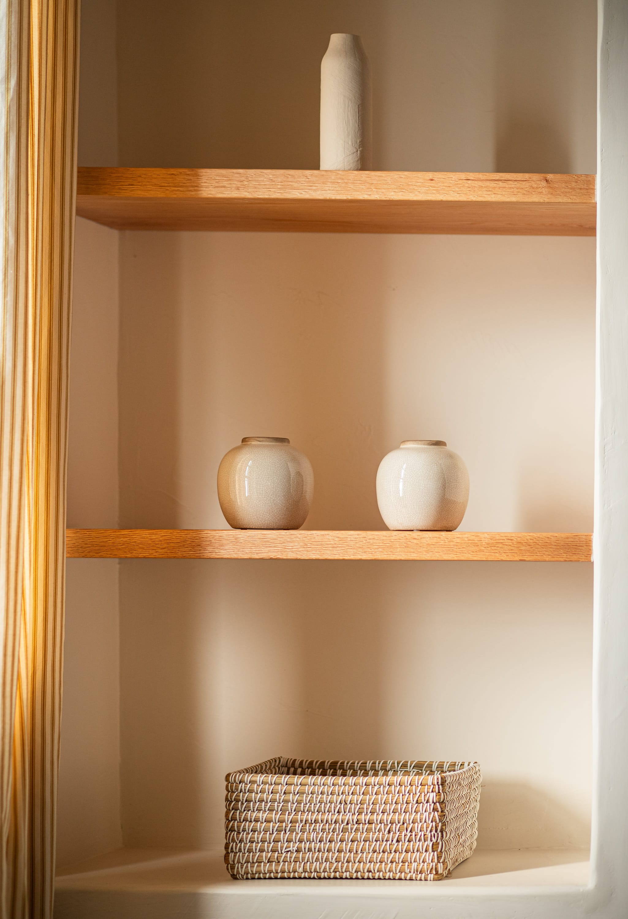 a shelf with a basket and a basket on it