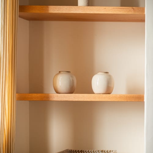 a shelf with a basket and a basket on it