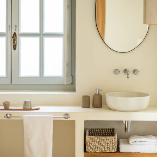 a bathroom with a large mirror