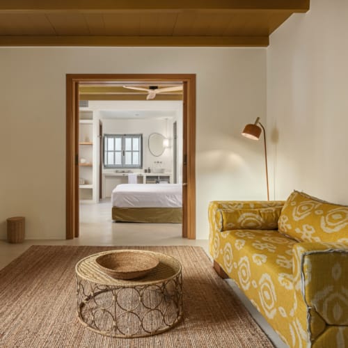 a bedroom with a bed and a couch