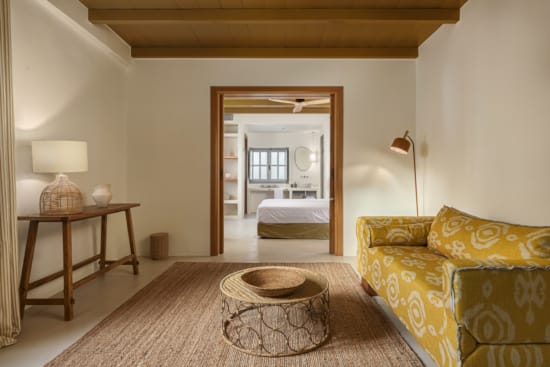 a bedroom with a bed and a couch