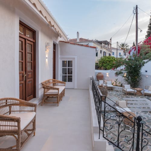 a patio with tables and chairs