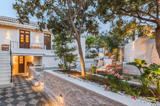 a courtyard with trees and flowers