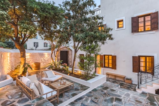 a modern looking house with a patio and a pool