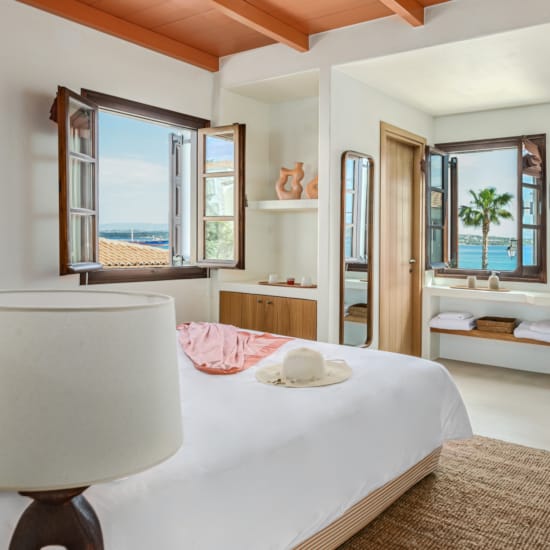 a bedroom with a large mirror