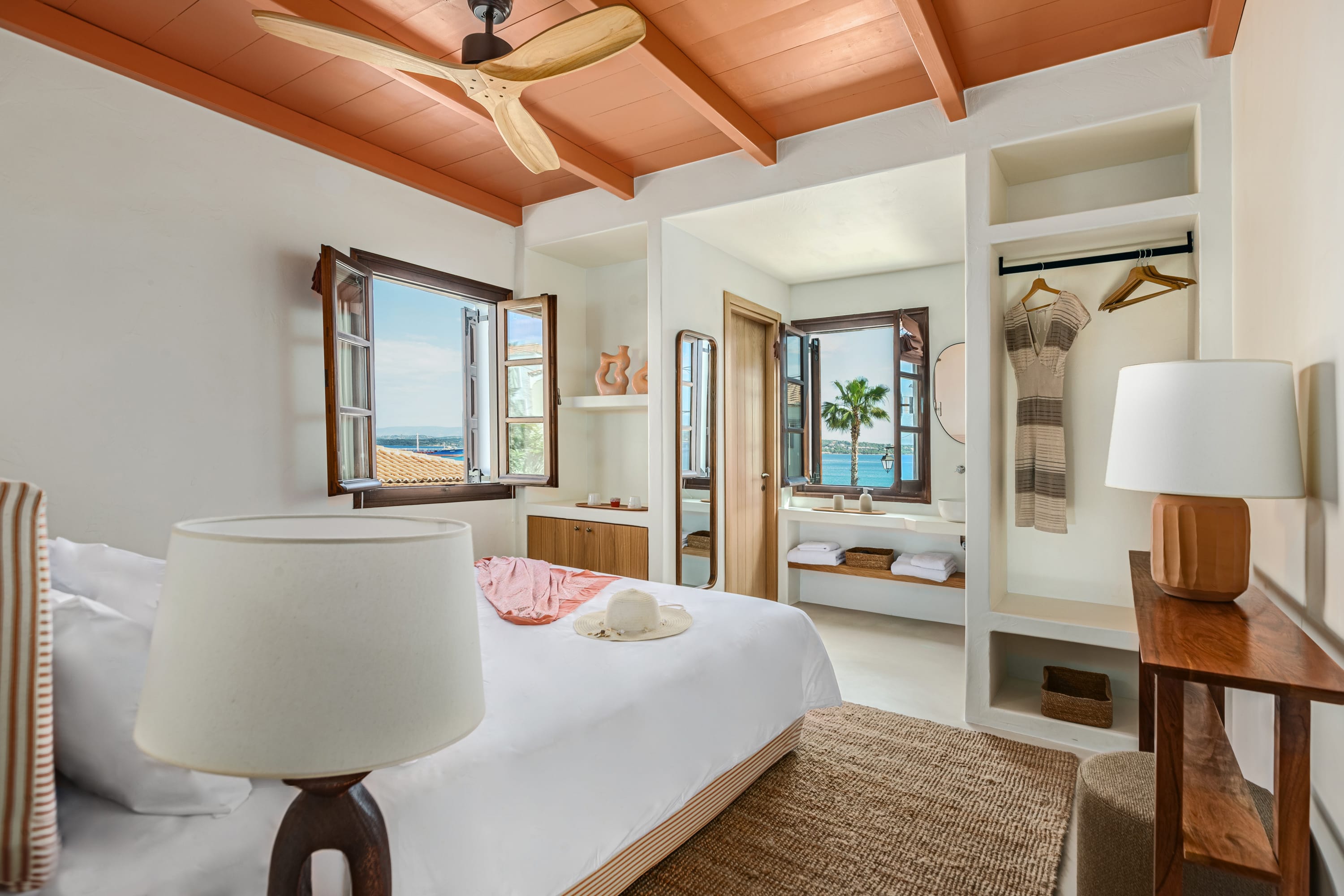 a bedroom with a bed and a lamp