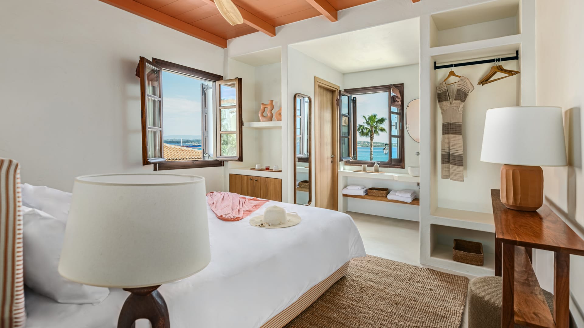 a bedroom with a bed and a lamp