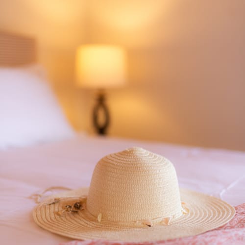 a hat on a bed