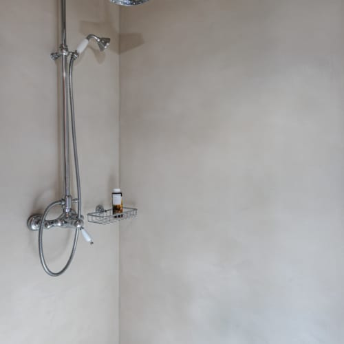 a shower head in a bathroom