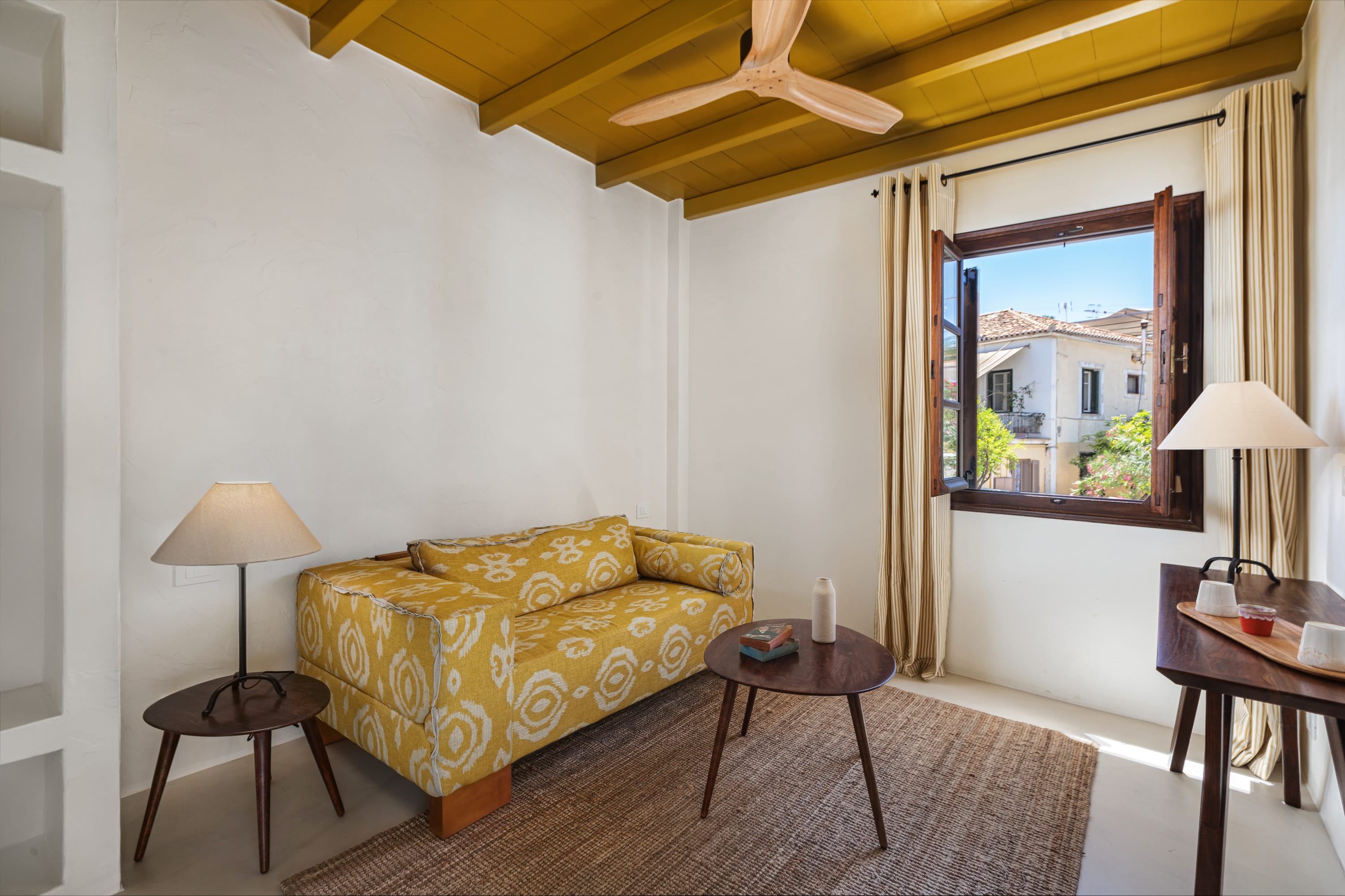 a living room with a yellow couch