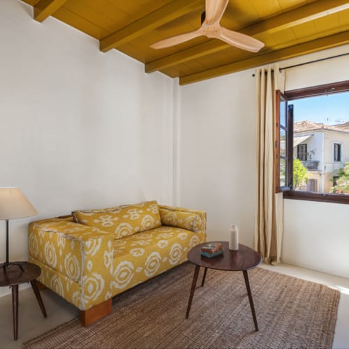a living room with a yellow couch
