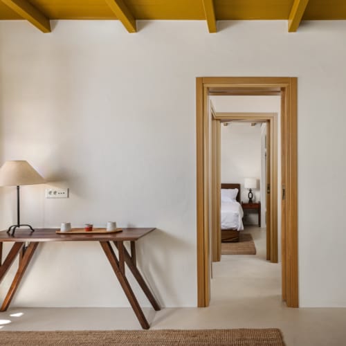 a room with a table and a lamp