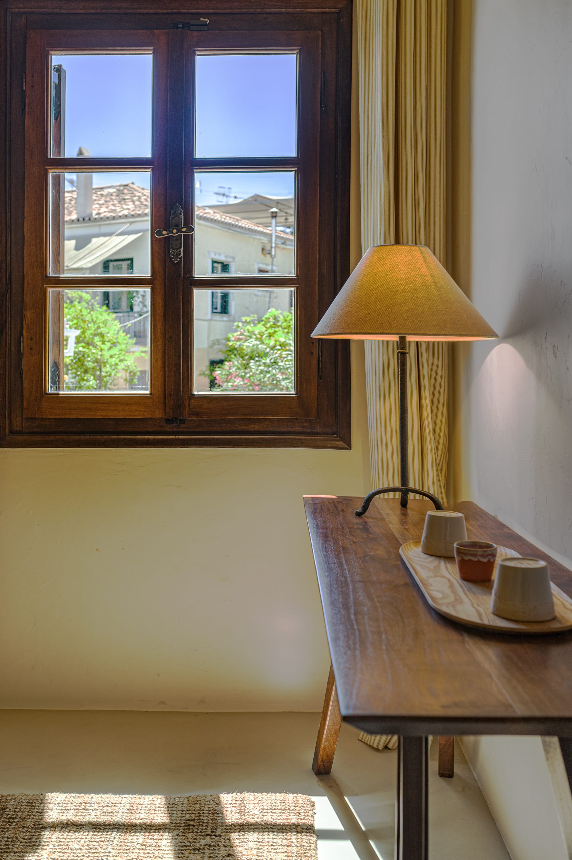 a lamp next to a window