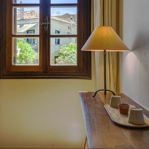 a lamp next to a window