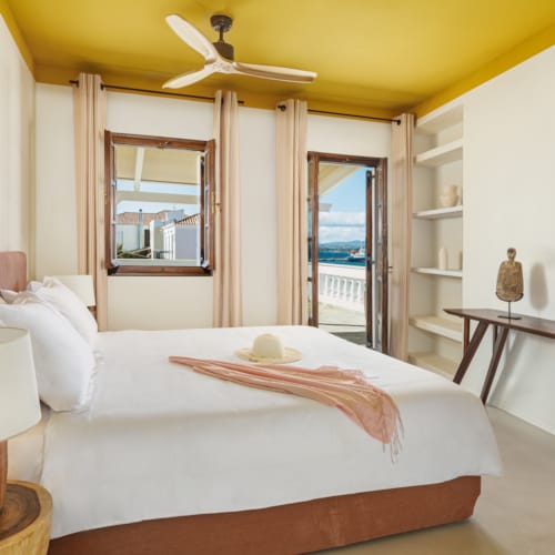 a bedroom with a large mirror