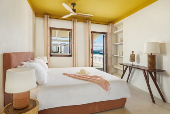 a bedroom with a large mirror