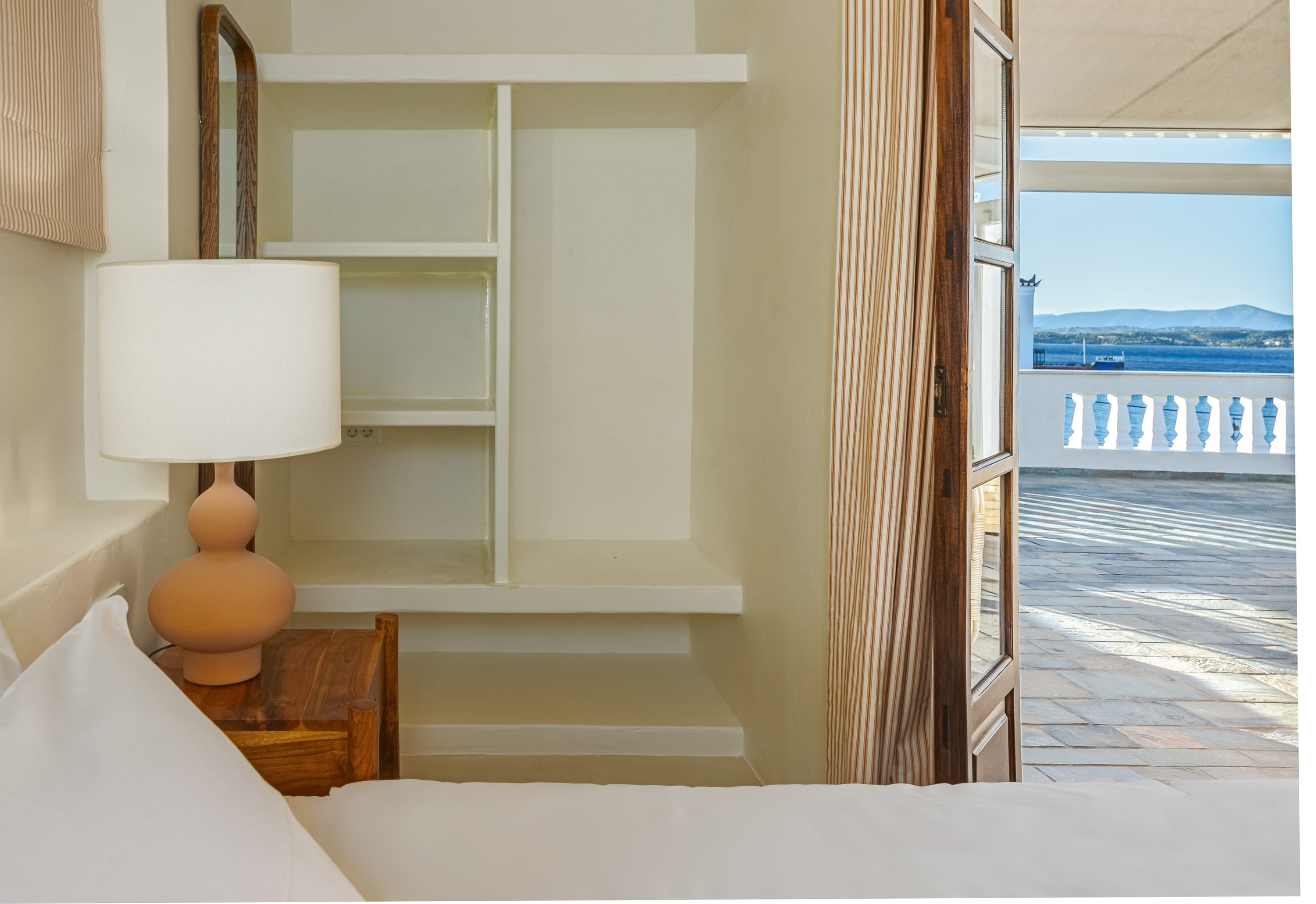 a room with a lamp and a window