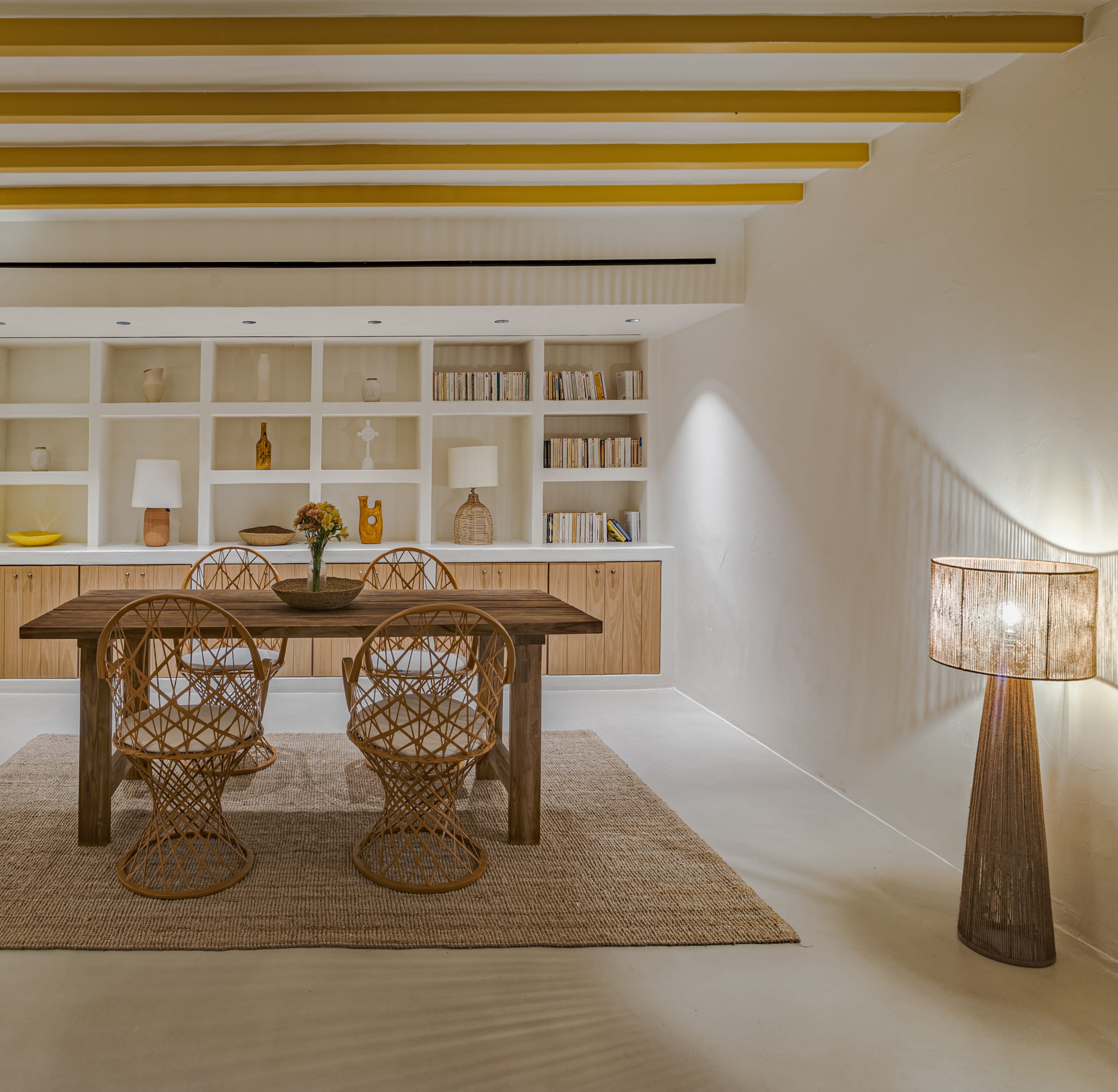 a dining room with a table and chairs