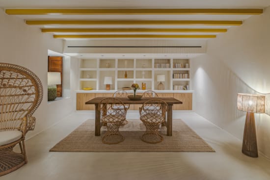 a room with a table and chairs