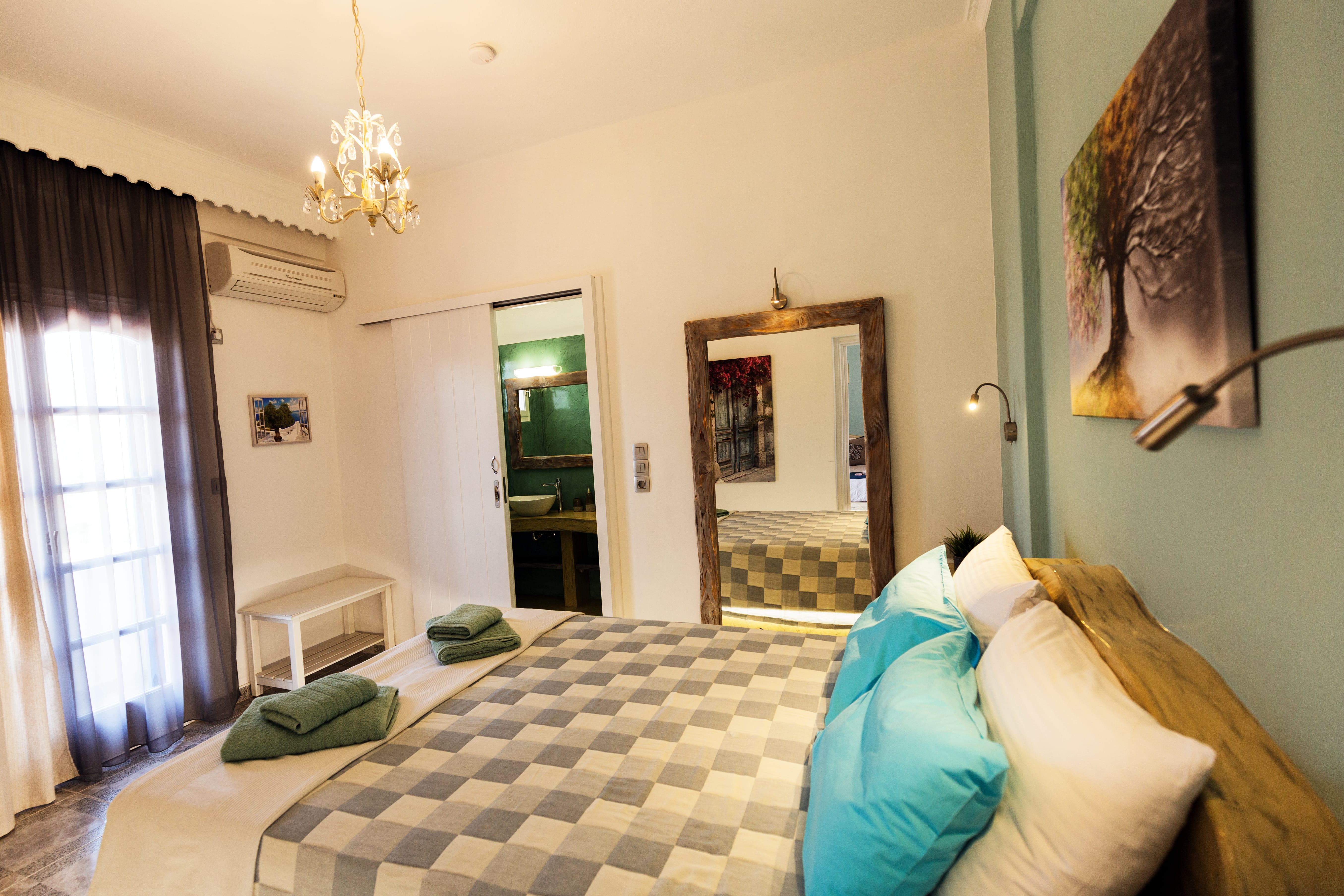 a bedroom with a large mirror