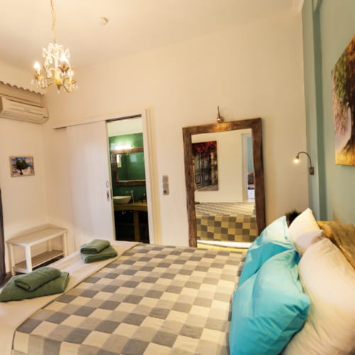 a bedroom with a large mirror