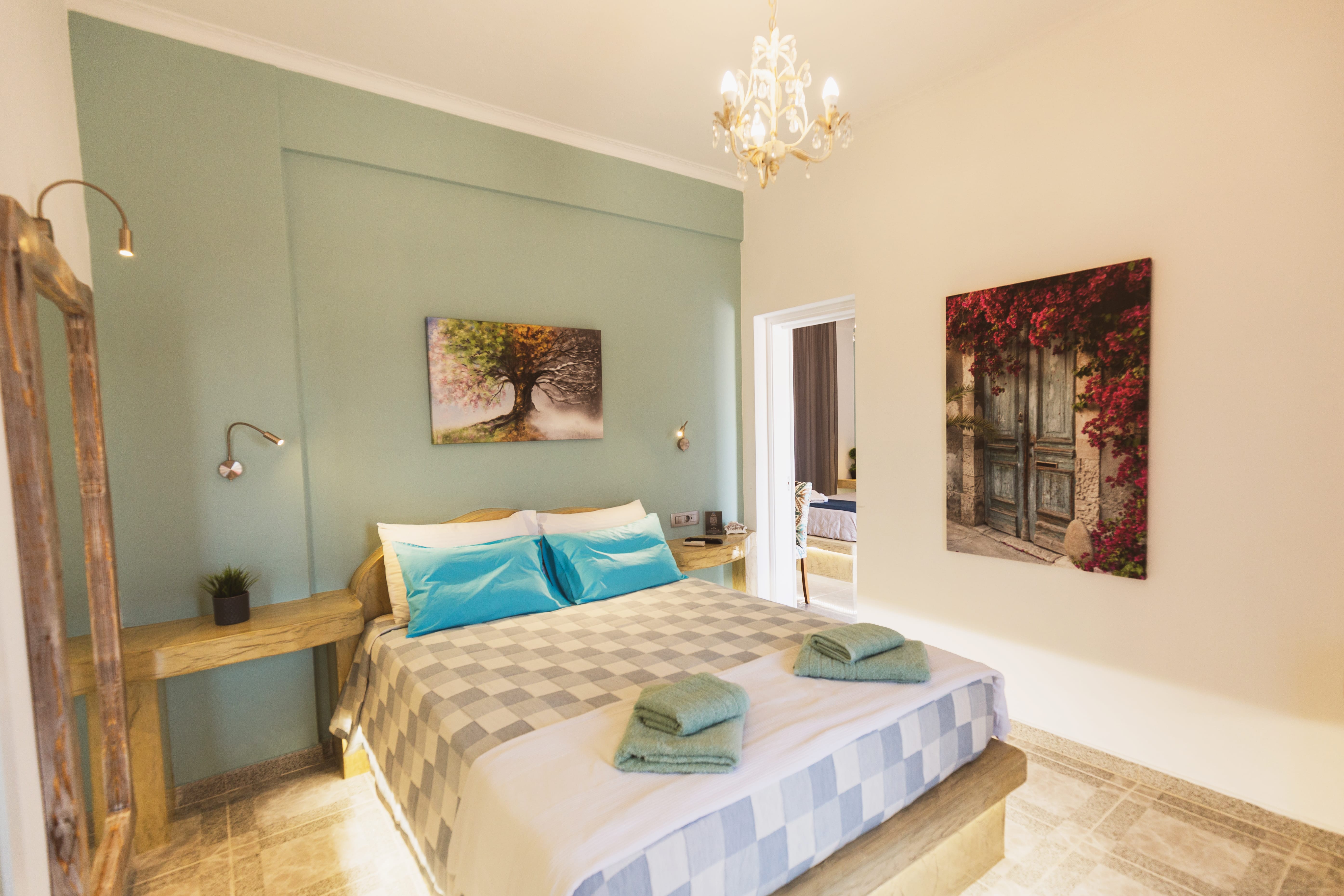 a bedroom with a bed and a lamp