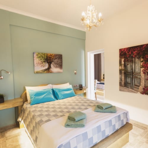 a bedroom with a bed and a lamp