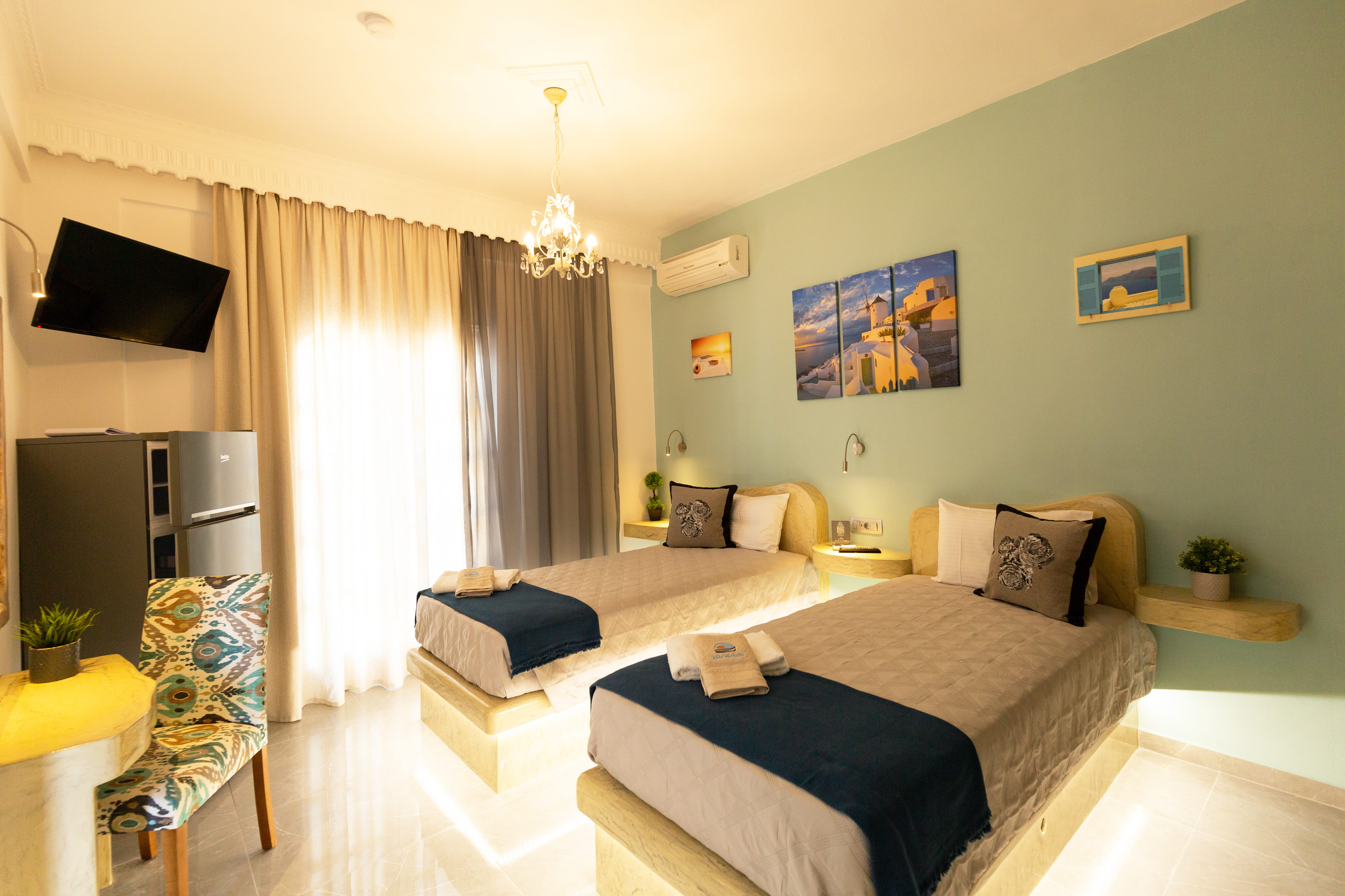 a bedroom with a bed and a television