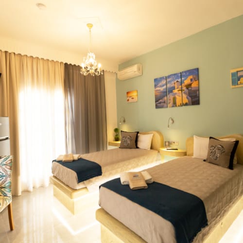 a bedroom with a bed and a television