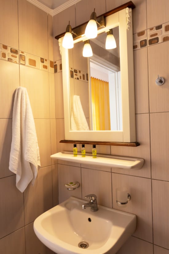 a bathroom with a mirror and sink