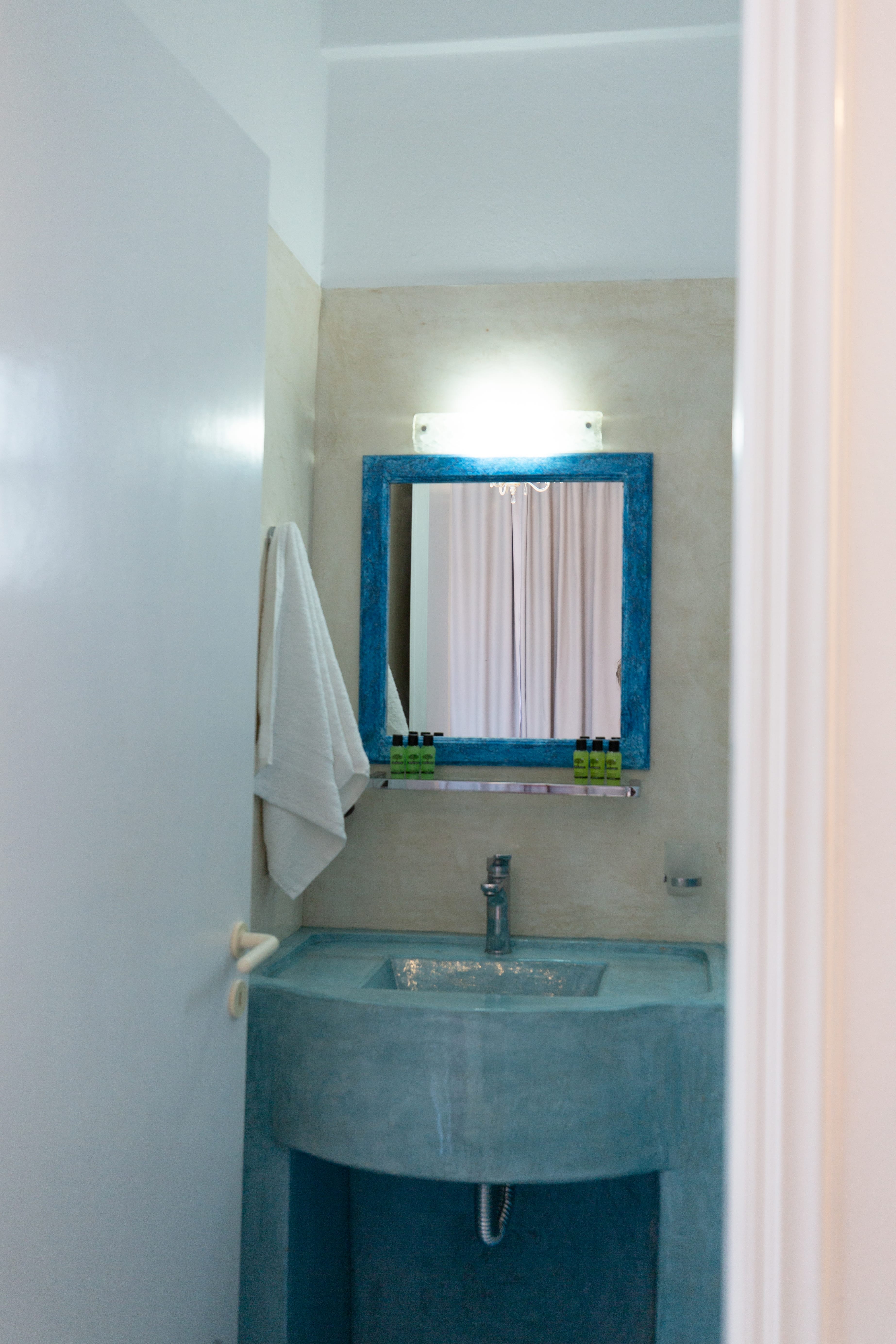 a bathroom with a mirror and sink