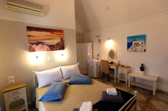 a bedroom with a bed and a desk