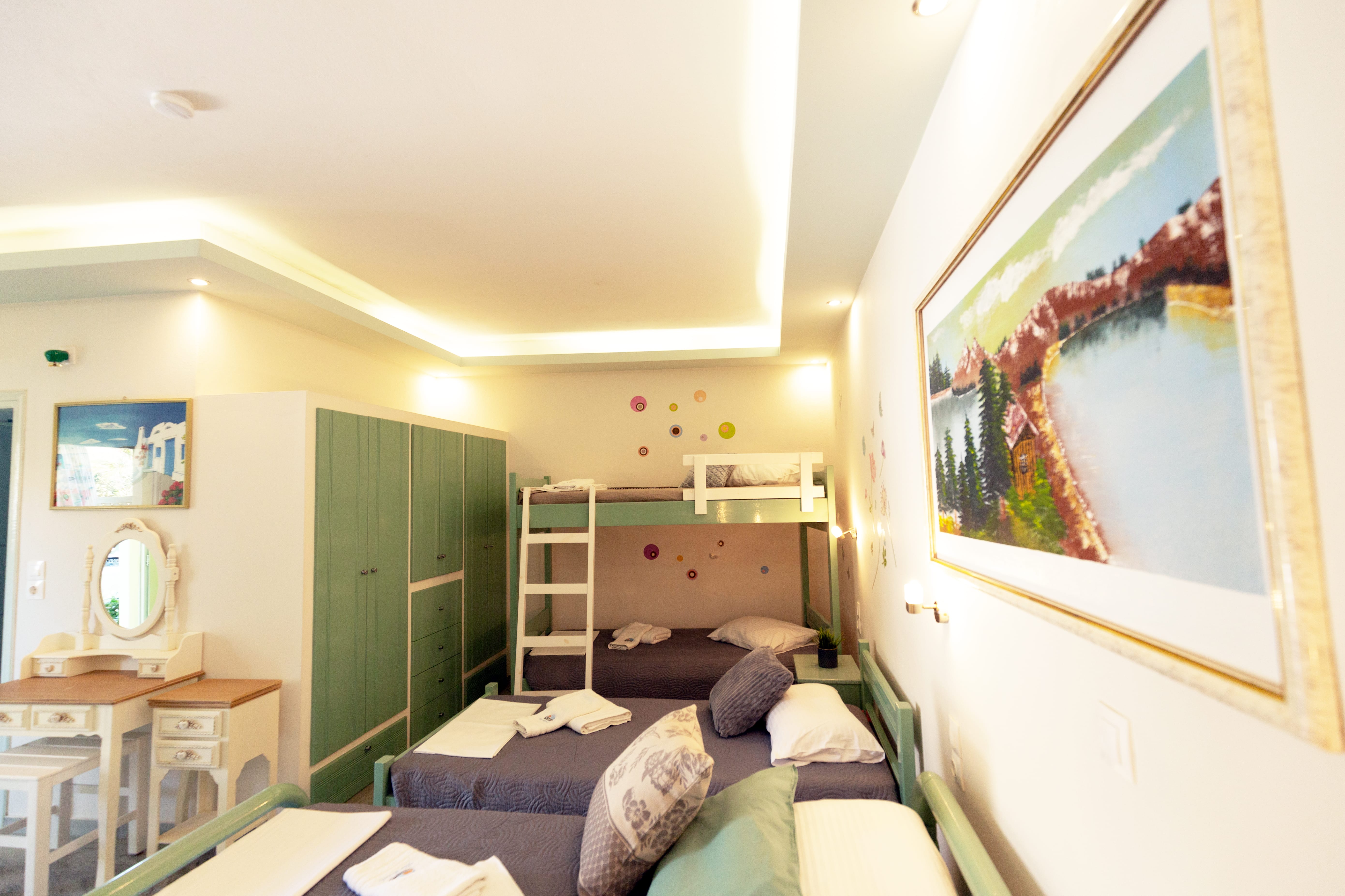 a bedroom with a bed and a painting on the wall