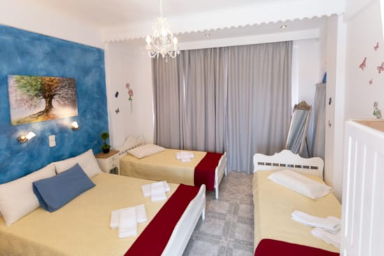 a room with a bed and couches