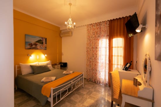 a bedroom with a bed and a lamp