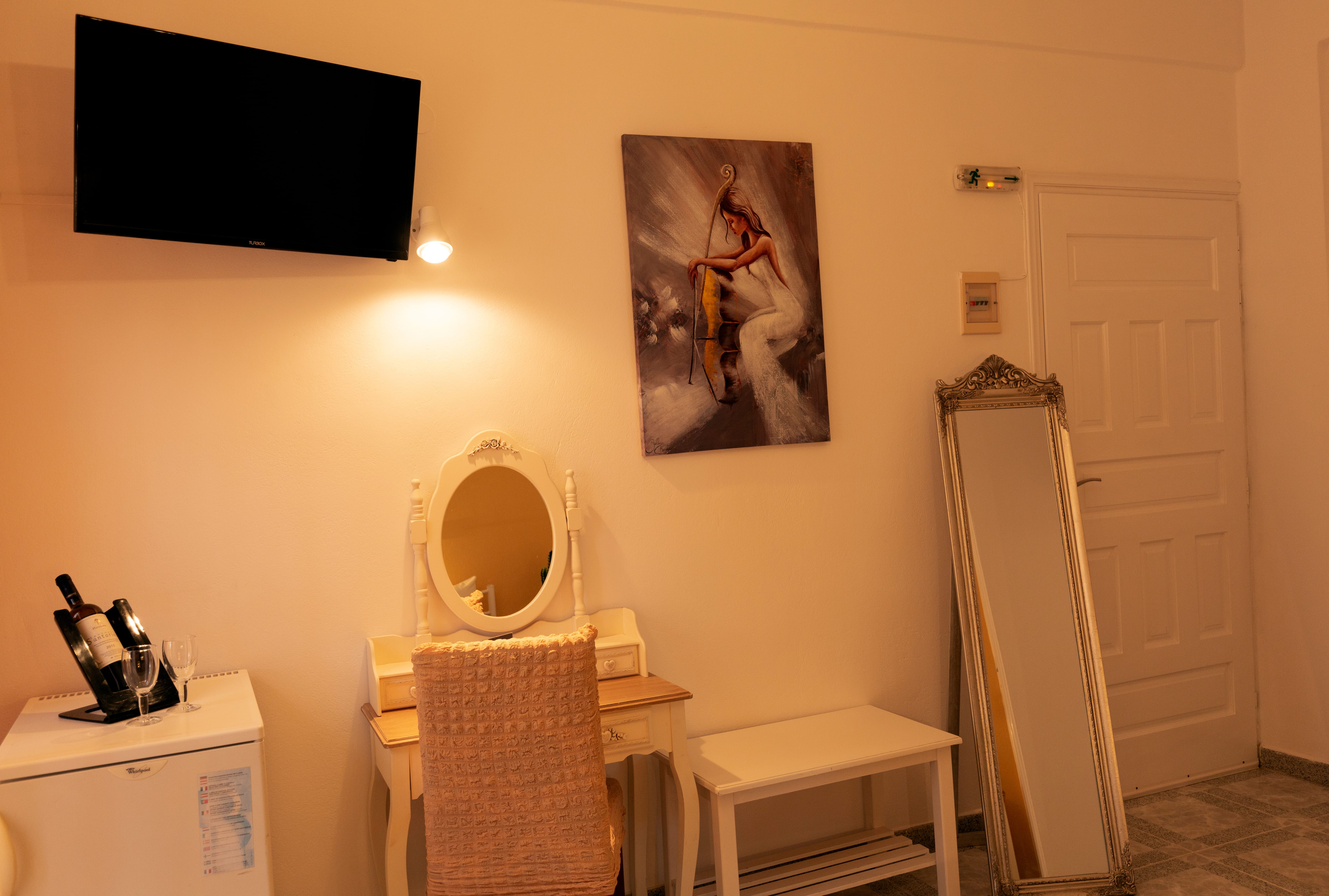 a room with a tv and a chair