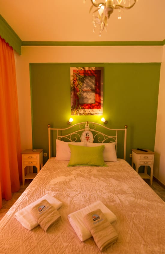 a bed with a white bed spread