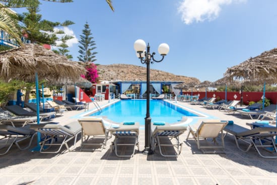 a pool with chairs around it