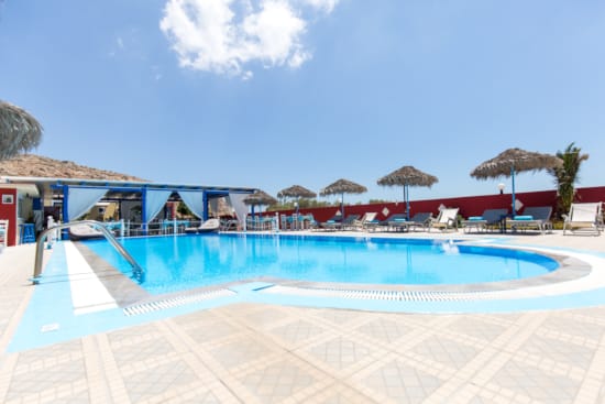 a swimming pool with umbrellas